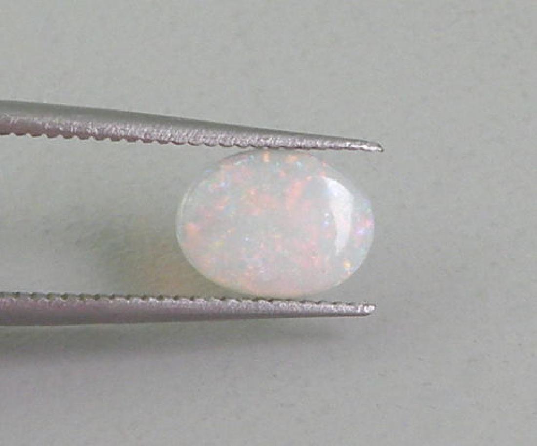 0.53ct NATURAL UNTREATED WHITE MULTI COLORED OPAL OVAL (1 of 2)