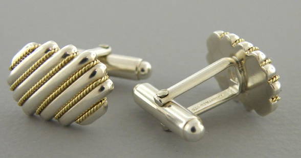 TIFFANY & Co. 18K GOLD STERLING SILVER ROPE CUFFLINKS: TIFFANY & CO 18K GOLD STERLING SILVER ROPE CUFFLINKS Face measures 0.75" L x 0.52" W 18K gold & Sterling silver cufflinks Pre-owned in good condition, please refer to pics Stamped TIFFANY & CO. 925