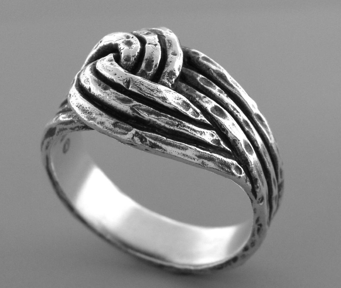 VINTAGE JAMES AVERY STERLING SILVER HAMMERED KNOT RING: JAMES AVERY STERLING SILVER RINGSize 9Measures 0.51" wide on topJames Avery Sterling silver hammered knot ring Vintage, Pre-owned, in good condition, please refer to picsStamped JA STER Weight: 7.9g
