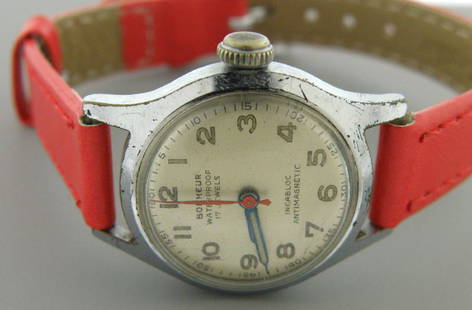 VINTAGE BONHEUR 17J INCABLOC ANTIMAGNETIC LADIES WATCH: Watch measures 7.50" long Face measures 23.5mm wide without crown Watch case is steel and new red leather band Strong wind up movement and keeps time Pre-owned, in good working condition, shows wear d