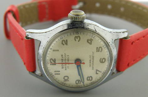 VINTAGE BONHEUR 17J INCABLOC ANTIMAGNETIC LADIES WATCH: Watch measures 7.50" long Face measures 23.5mm wide without crown Watch case is steel and new red leather band Strong wind up movement and keeps time Pre-owned, in good working condition, shows wear d