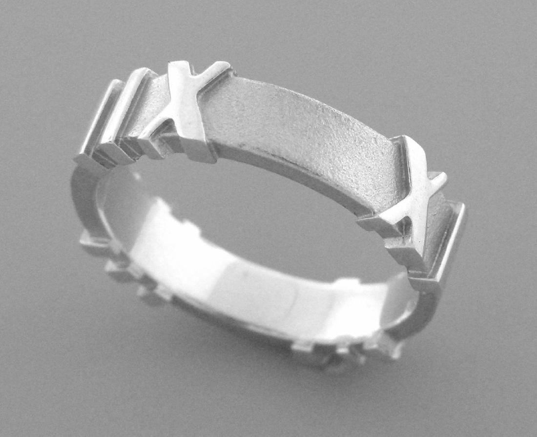 TIFFANY & Co. STERLING SILVER ATLAS ROMAN NUMERALS BAND: Ring size is a 6 Ring measures 4.7 mm wide Sterling silver, Roman Numerals all the way round Ring is in Excellent condition Stamped ATLAS (C) 2006 TIFFANY & Co. 925 Total weight 3.6 grams