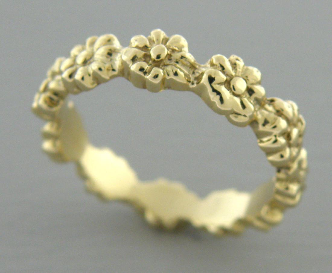VINTAGE 14K GOLD RING FLOWER ETERNITY DESIGN BAND RING: Ring size is a 6 Ring measures 4.5mm wide 14K yellow gold wedding band flower pattern all the way around Vintage pre-owned ring is in good condition for it's age, please refer to pics Stamped 14K Tota