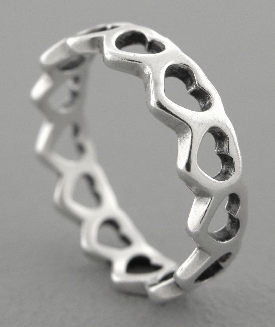 JAMES AVERY STERLING SILVER ETERNITY HEART BAND RING: JAMES AVERY STERLING SILVER RINGSize 5Measures 4.2mm wide James Avery Sterling silver eternity heart ring Vintage, Pre-owned, in good condition, please refer to picsStamped AVERY 925Weight: 1.5g