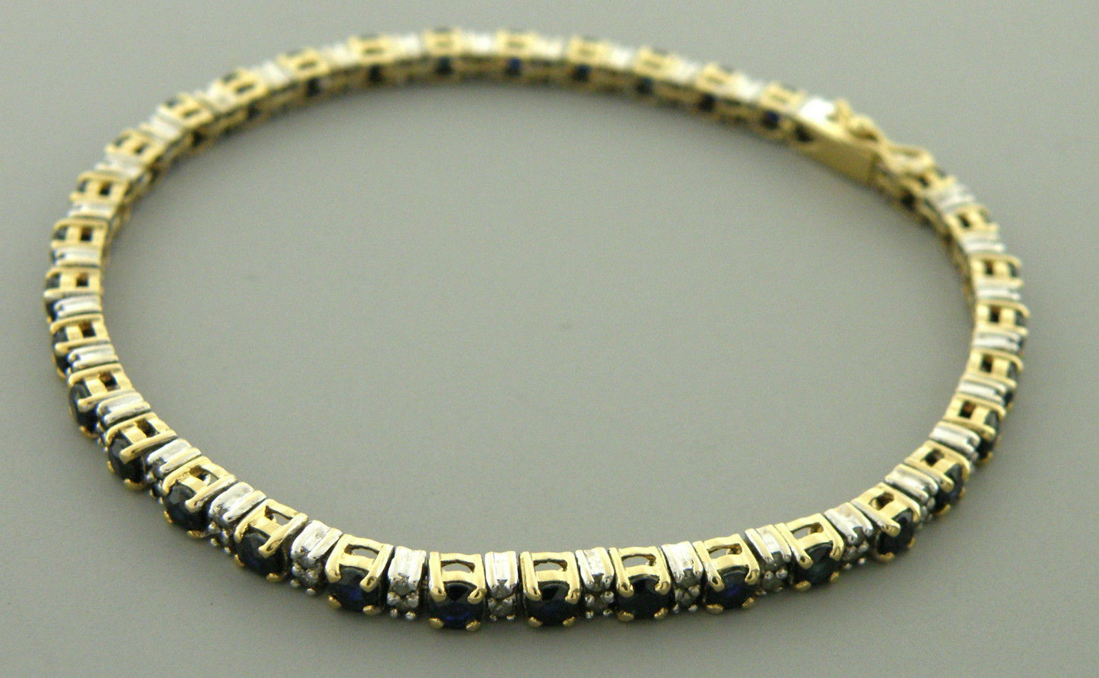 VINTAGE 14K GOLD SAPPHIRE DIAMOND TENNIS BRACELET: Bracelet measures 7.10" Long X 3.2mm Wide Sapphire and Diamond 68 old single cut Diamonds apx 0.01ct each, Total weight 0.68ct 34 Sapphire, 0.10ct each, Total weight 3.40ct Total CT weight 4.08ct Vint