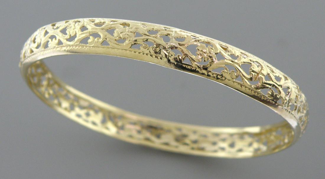 14K YELLOW GOLD LADIES MOROCCAN BANGLE BRACELET: 14K YELLOW GOLD LADIES BANGLE Bangle measures 8" Long (will fit upto 8" wrist) Bangle measure apx 8.8mm Wide 14K Yellow Gold Moroccan Bangle Pre-owned in Excellent condition, please refer to pcs Tests