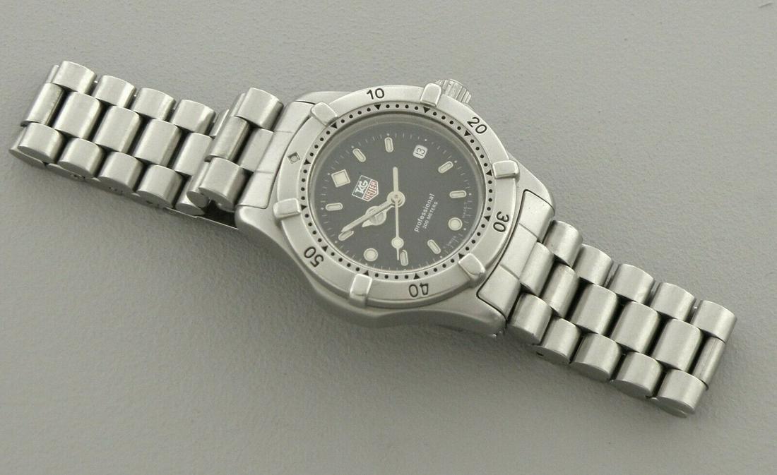 TAG HEUER PROFESSIONAL LADIES STAINLESS STEEL WATCH: TAG HEUER PROFESSIONAL LADIES WATCH Watch will fit a wrist size of 6" Face measures 27.5mm wide without crown Tag Heuer professional 200 meters ladies stainless steel watch Pre-owned, in good conditio