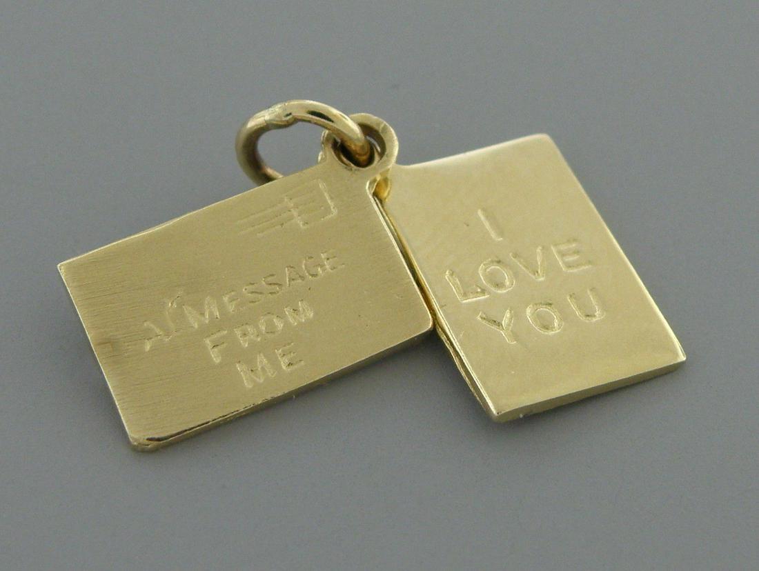 14K ENVELOPE MESSAGE I LOVE YOU PENDANT CHARM: Pendant measures 0.55" H x 0.32" W 14K yellow gold Pendant / charm Top piece says "a message from me" second piece says "I LOVE YOU" pre-owned, shows wear due to age, please refer to pics Stamped 14K