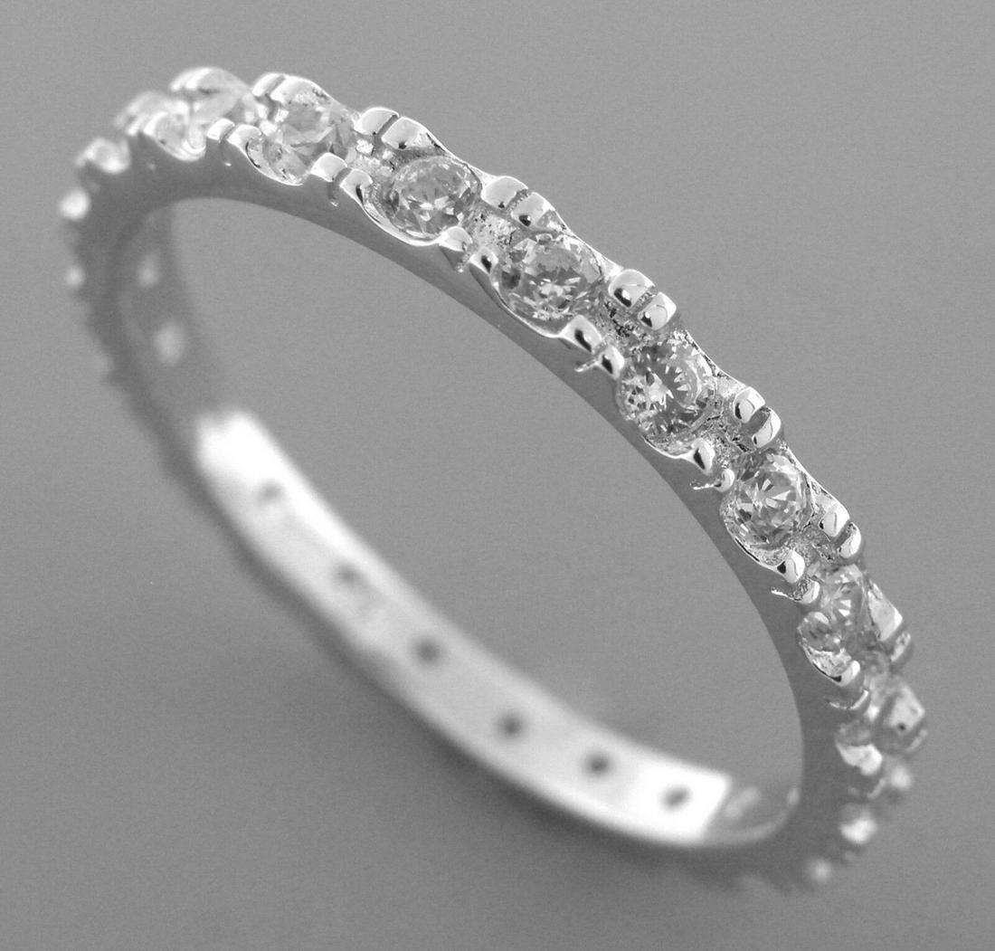 STERLING SILVER CZ FULL ETERNITY WEDDING BAND RING: NEW STERLING SILVER WEDDING BAND RING SIZE 6 Ring is a size 6 Full eternity with round CZ Rings measures 2.3 mm wide Sterling silver, set with CZ New Stamped 925 Total weight 1.9 grams
