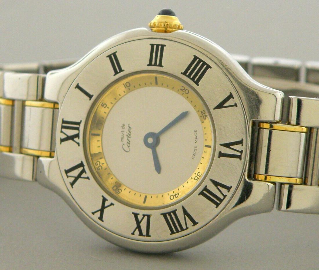 MUST DE CARTIER 21 GOLD STAINLESS STEEL LADIES WATCH: CARTIER 21 STAINLESS STEEL WATCH Watch will fit a wrist size of 6" Face measures 28mm wide without crown Must de Cartier 21 stainless steel womens watch Quartz movement Pre-owned, in good condition, m