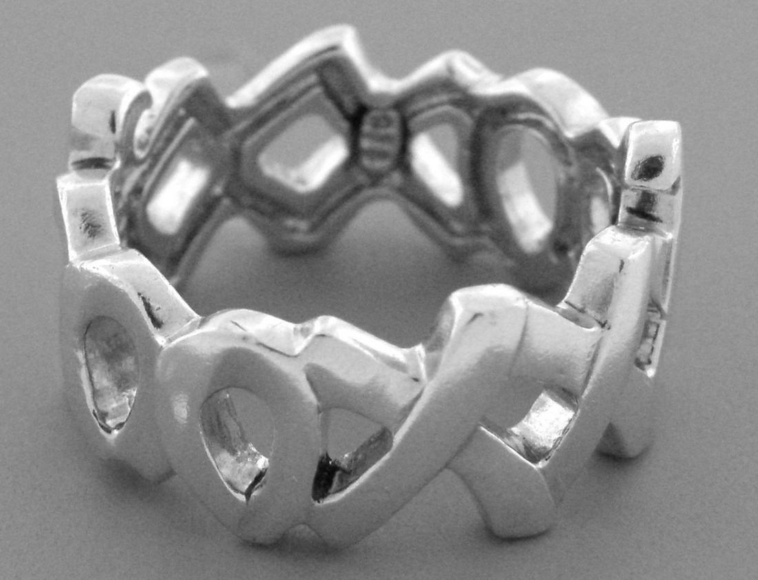 TIFFANY & Co. STERLING SILVER XOXO PALOMA PICASSO RING: TIFFANY & Co. XOXO STERLING SILVER WEDDING BAND RING SIZE 5 Ring size is a 5 Ring measures 10 mm wide Sterling silver, XO pattern all the way around Pre-owned ring is in good condition, please refer t