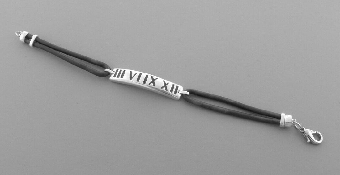 TIFFANY & CO. STERLING SILVER RUBBER ATLAS BRACELET (1 of 2)