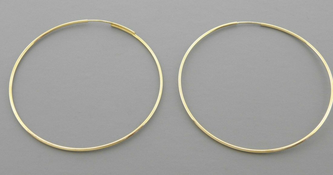 14K YELLOW GOLD ROUND HOOP TUBE EARRINGS 1.2mm LARGE: 14K YELLOW GOLD HOOP EARRINGS 14K Yellow Gold Tube hoop earrings Width Size: 1.2mm Diameter: 45mm, High Polish 14k gold Stamp: 14k Avg Weight: 45mm - 1.6g