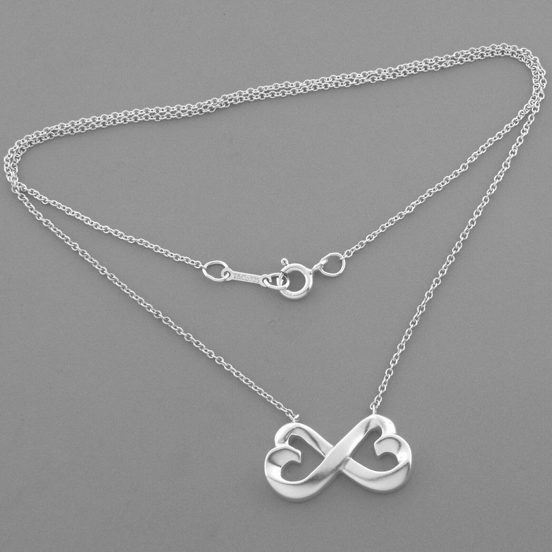 TIFFANY & CO. SILVER PICASSO LOVING HEART NECKLACE: TIFFANY & CO. STERLING SILVER HEART NECKLACE Tiffany & Co. Sterling silver Paloma picasso loving heart Necklace Measures 16" Long Pendant Measures 0.86" Long x 0.45" High Pre-owned, in good condition,