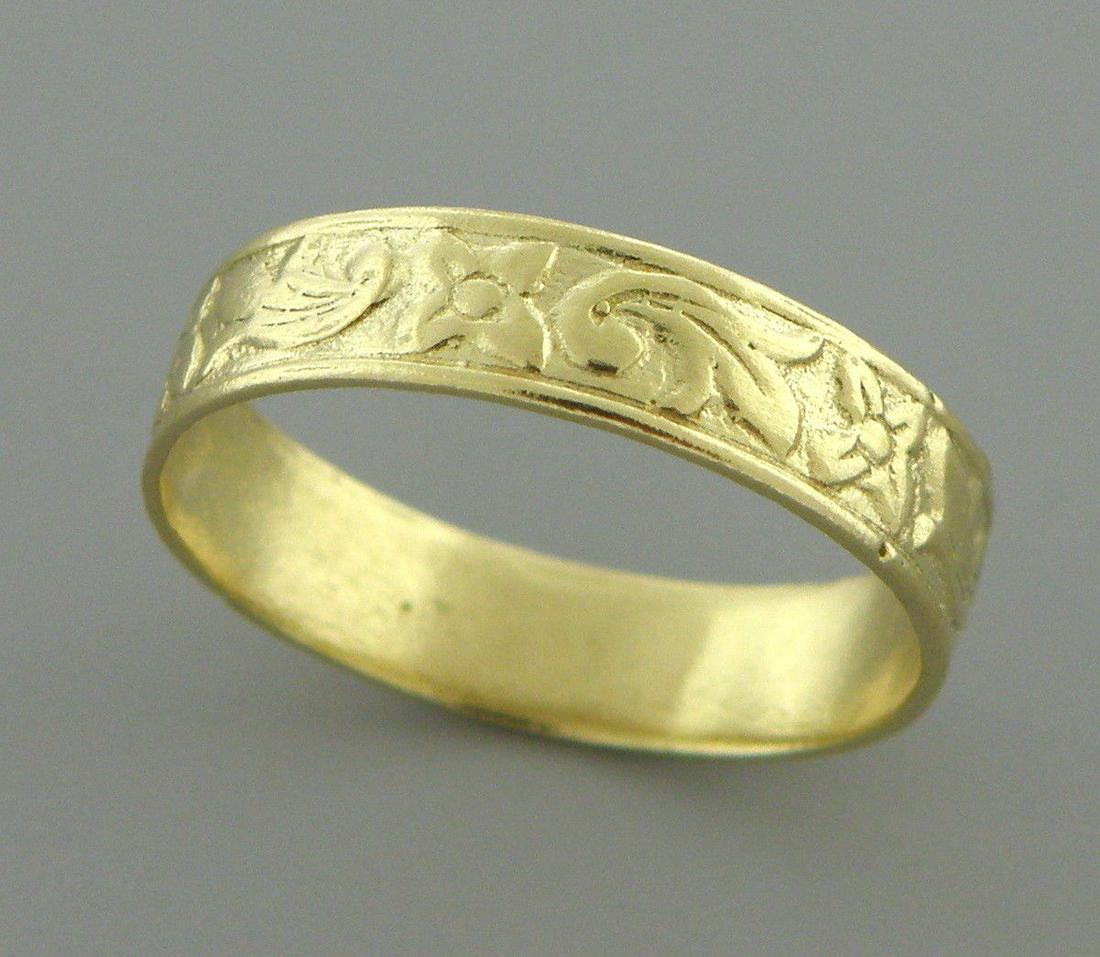 18K Y/ GOLD RING FULL ETERNITY FLOWER WEDDING BAND: 18K YELLOW GOLD WEDDING BAND RING SIZE 6.5 Ring size is a 6.5 Ring measures 4.3mm wide 18K yellow gold wedding band, pattern all the way around Pre-owned ring is in good condition, minor wear, please 