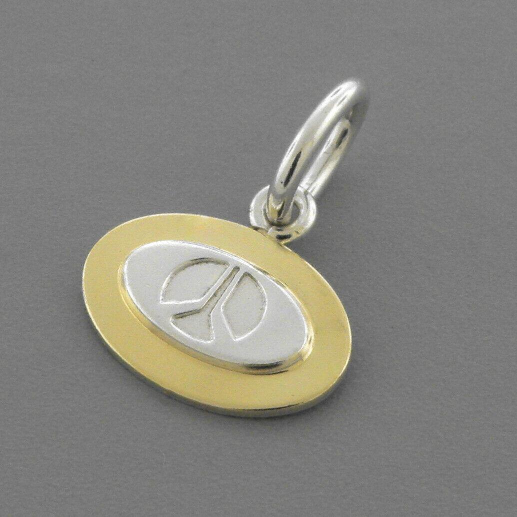 TIFFANY & CO. 18K GOLD SILVER NASA ROCKWELL PENDANT (1 of 2)