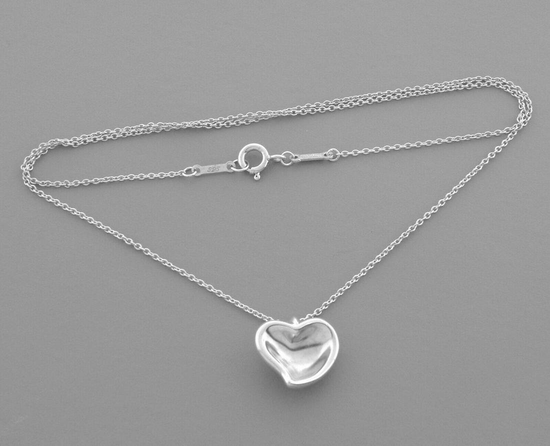 TIFFANY & CO. STERLING SILVER FULL HEART NECKLACE: TIFFANY & CO. STERLING SILVER HEART NECKLACE Tiffany & Co. Sterling silver Elsa Peretti full heart Necklace Measures 16" Long Heart measures 0.54" Wide x 049" High Pre-owned, in good condition, please