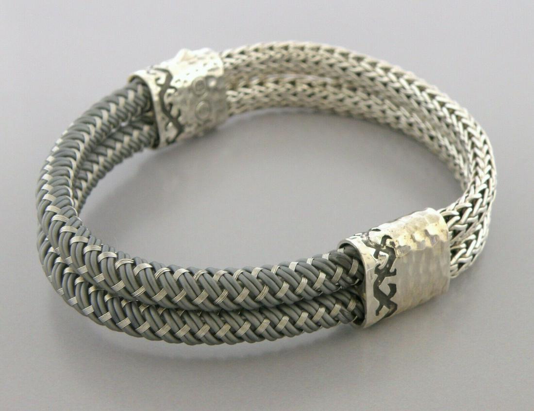 JOHN HARDY STERLING SILVER RUBBER WOVEN MENS BRACELET POUCH: JOHN HARDY STERLING SILVER BRACELET Bracelet will fit upto 8.25" wrist Width is 0.58" John Hardy Sterling silver woven bracelet with hidden clasp Double strap, half sterling silver, half with rubber w