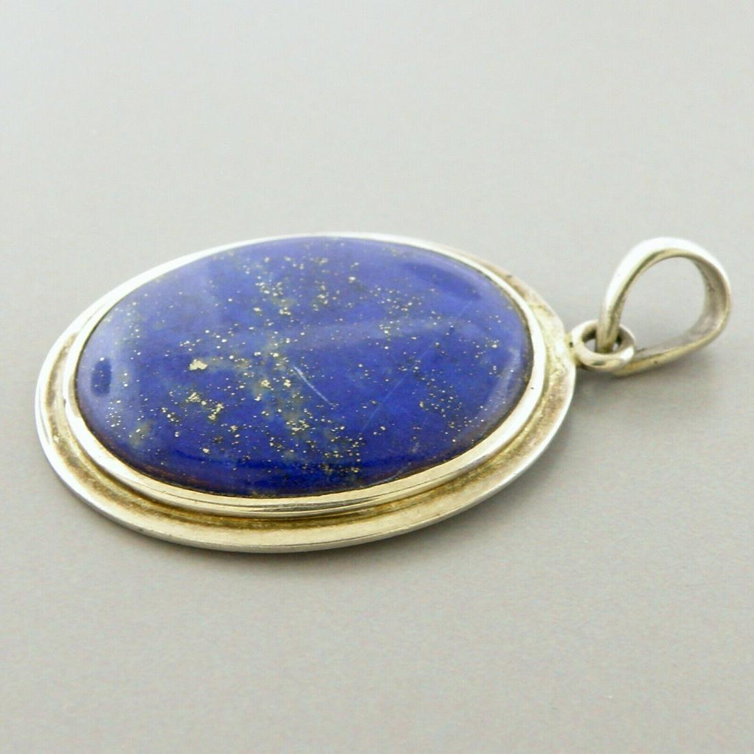 VINTAGE STERLING SILVER LAPIS LAZULI OVAL PENDANT: VINTAGE STERLING SILVER PENDANT Sterling silver lapis lazuli pendant Beautiful blue and gold colored gemstone Measures 1.71" Long x 1.08" Wide Vintage, Pre-owned, in good condition for its age, please