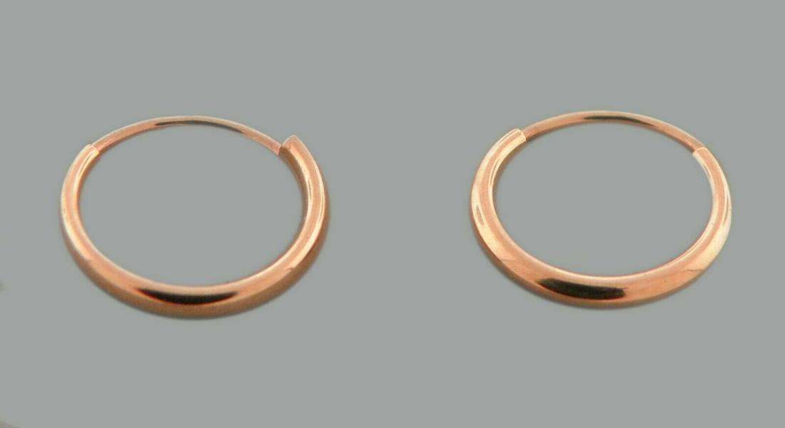 NEW 14K ROSE GOLD SMALL BABY ROUND TUBE HOOP EARRINGS: NEW 14K ROSE GOLD EARRINGS New 14K Rose Gold Hoop Earrings Measures: 1.2mm Wide x 10mm in Diameter Small baby size Earrings have a polished finish Endless Back Stamp: 14k Avg Weight: 0.3g