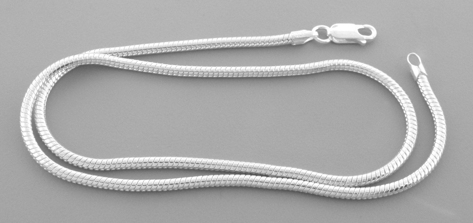SNAKE CHAIN STERLING SILVER ITALIAN NECKLACE 2mm 18": NEW STERLING SILVER SNAKE CHAIN NECKLACE New sterling silver snake chain necklace 2mm wide Length 18" Well made chain Chain is silver Lobster clasp Sterling silver 925, polished finish Chain is New 12