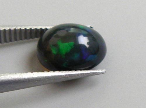 1.25ct AFRICAN BLACK OPAL OVAL CABOCHON CUT NATURAL (1 of 2)