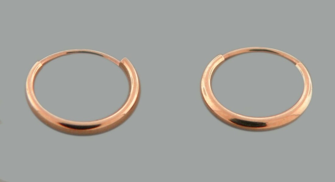 NEW 14K ROSE GOLD SMALL BABY ROUND TUBE HOOP EARRINGS: NEW 14K ROSE GOLD EARRINGS New 14K Rose Gold Hoop Earrings Measures: 1.2mm Wide x 10mm in Diameter Small baby size Earrings have a polished finish Endless Back Stamp: 14k Avg Weight: 0.3g