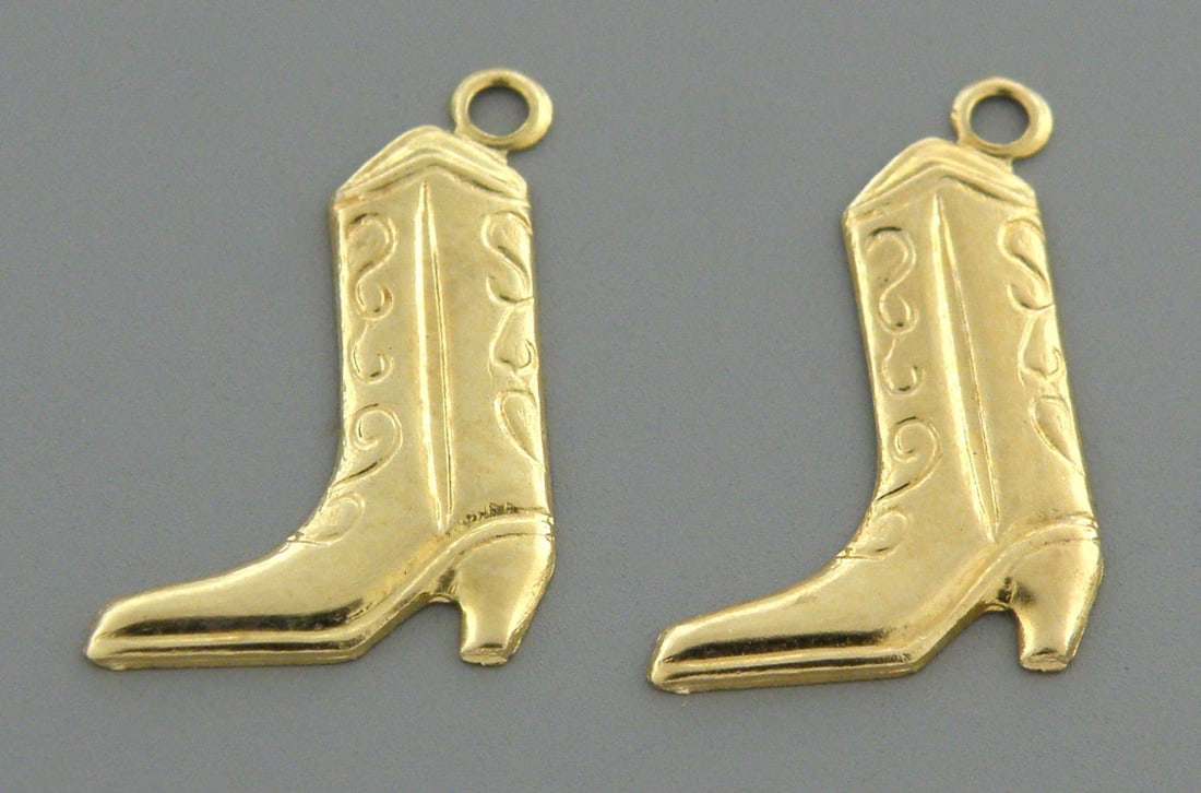 14K YELLOW GOLD GIRLS EARRING JACKETS CHARMS DANGLE: NEW 14K YELLOW COLOR GOLD EARRING JACKETS / CHARM Earring dangle measure 0.56" H x 0.38" W 14k Yellow cowboy bots design, meant to put earring post inside and hangs from stud New in good condition, pl