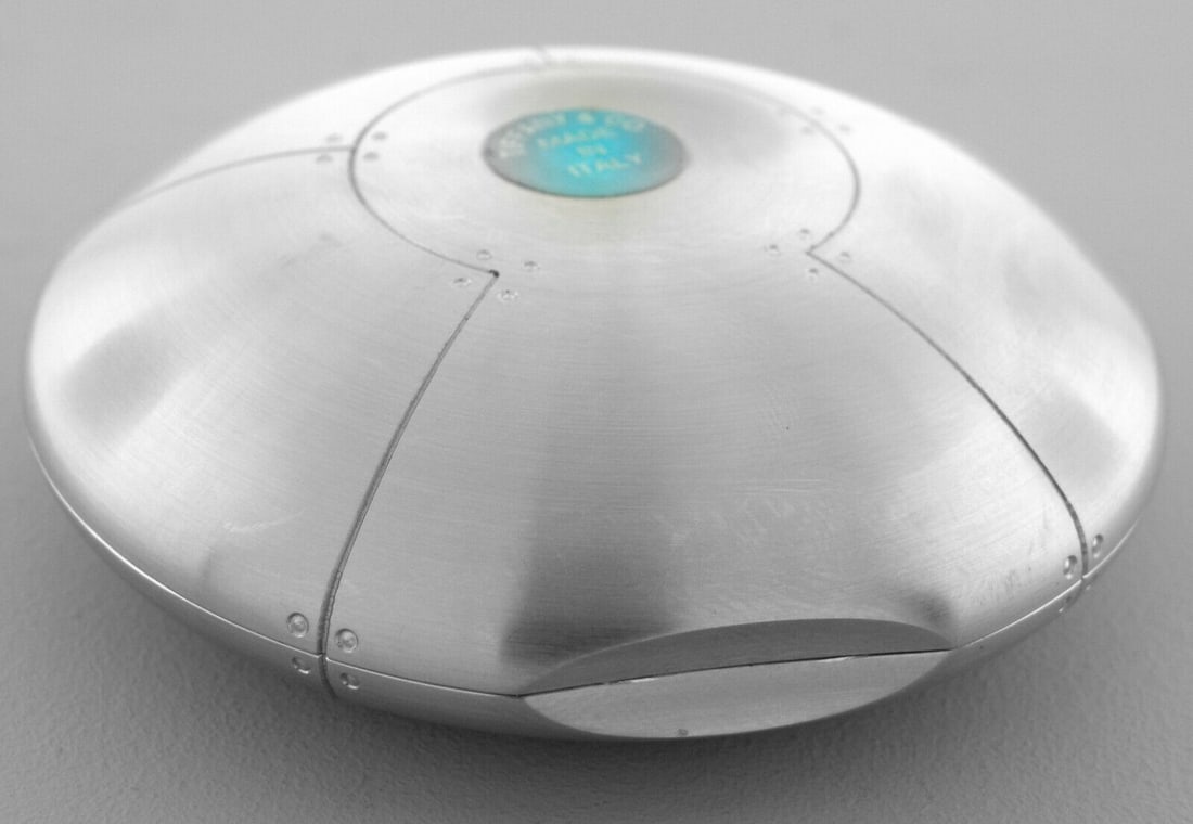 TIFFANY & CO. STAINLESS STEEL STREAMERICA PILL BOX: TIFFANY & CO. STREAMERICA PILL BOX Measures apx 2.91" in diameter x 0.96" High Tiffany & Co. stainless steel streamerica heavy pill box (can be used as a paperweight) Pre-owned in good condition, hows