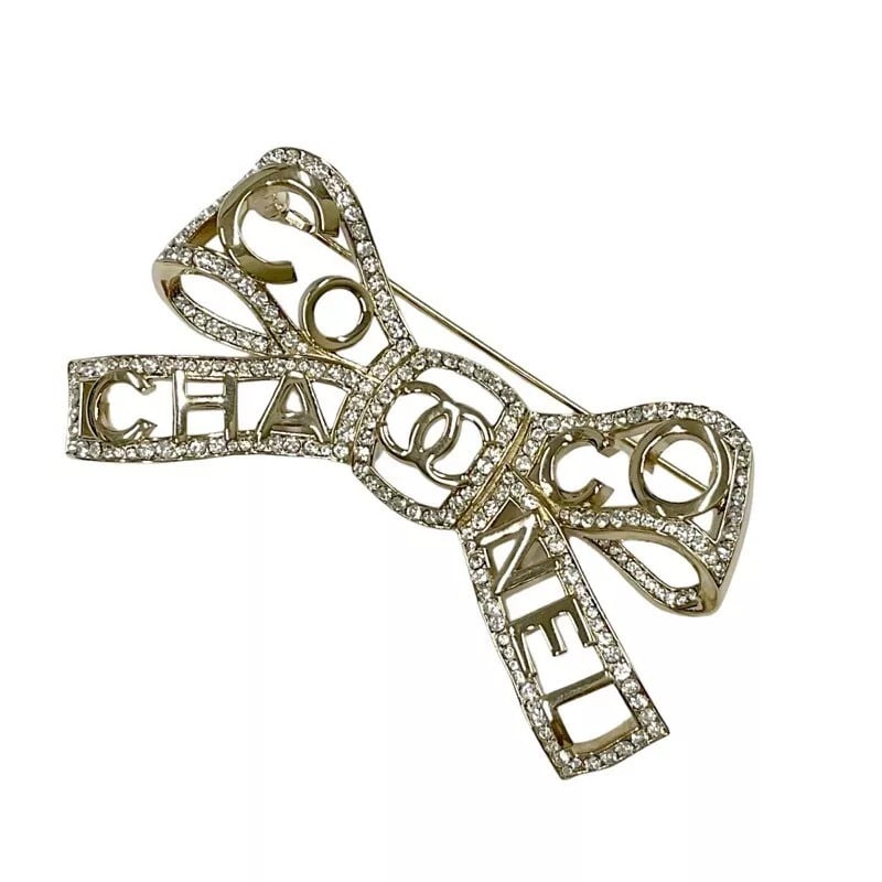 CHANEL Brooch Pin Badge Ribbon Motif CC Rhinestone COCO Gold GP B20B authentic (1 of 3)