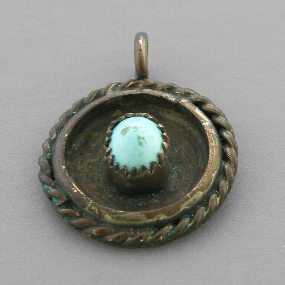 VINTAGE NAVAJO STERLING SILVER TURQUOISE PENDANT: VINTAGE TURQUOISE STERLING SILVER PENDANT Vintage Navajo Turquoise sterling silver pendant Measures 0.97" H x 0.77" W Vintage, Pre-owned, in good condition for its age, please refer to pics Due to age