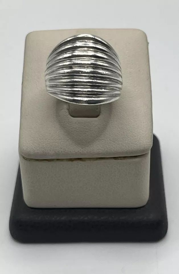 STERLING SILVER SIZE 6 CIGAR STYLE RING: Elevate your fashion game with this exquisite cigar style ring made of high-quality sterling silver. The ring has a beautiful polished finish that adds to its overall charm and elegance. Crafted with 