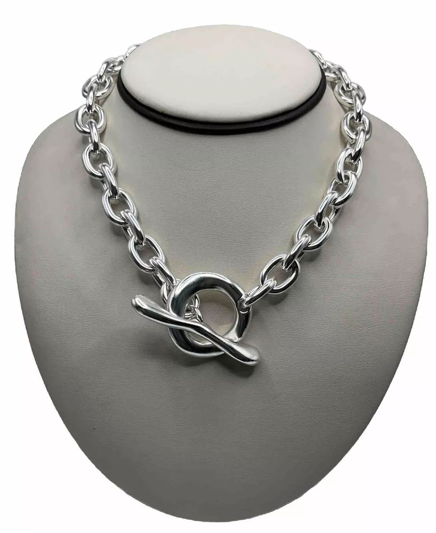 HEAVY STERLING SILVER FANCY LINKED CHAIN 150.7 GRAMS: Elevate your everyday look with this heavy and fancy linked chain made of high-quality 925 sterling silver. With its sturdy and reliable toggle closure, this chain is perfect for any occasion and will