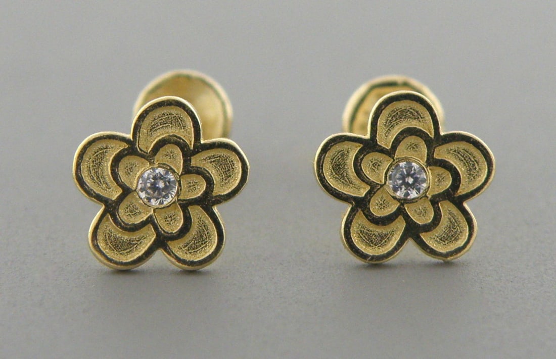 NEW 14K YELLOW GOLD CZ BABY STUD FLOWER EARRINGS: Earrings measure 5.8mm in diameter 14K Yellow gold, cz flower earrings Screw backs New Stamped 14K on earrings and earring backs Total weight 0.4 grams