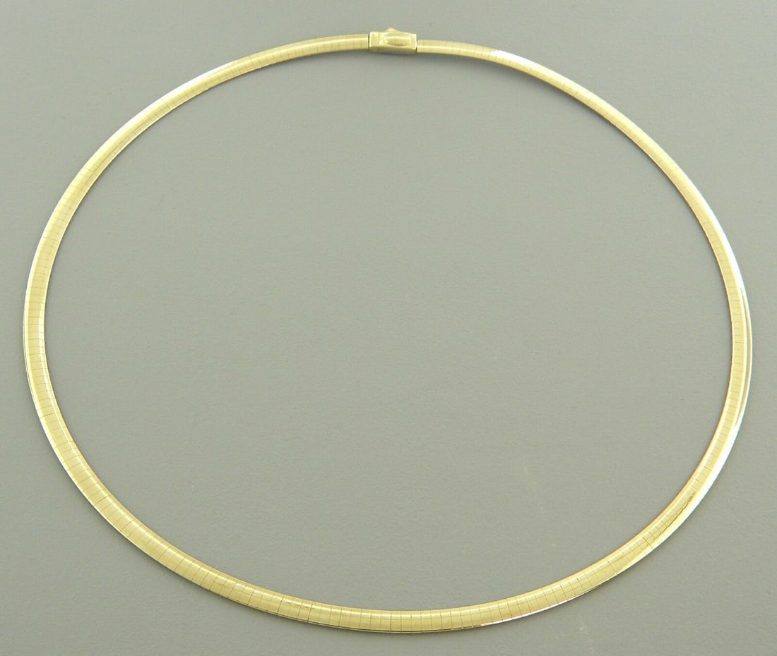 14K GOLD OMEGA CHAIN NECKLACE REVERSIBLE DOUBLE SIDED: NEW 14K GOLD OMEGA NECKLACE New 14K Yellow and white Gold Omega chain necklace One Side Yellow gold and the other side white gold, can be worn either way Measures: 16" Long x 4mm Wide Polished finish