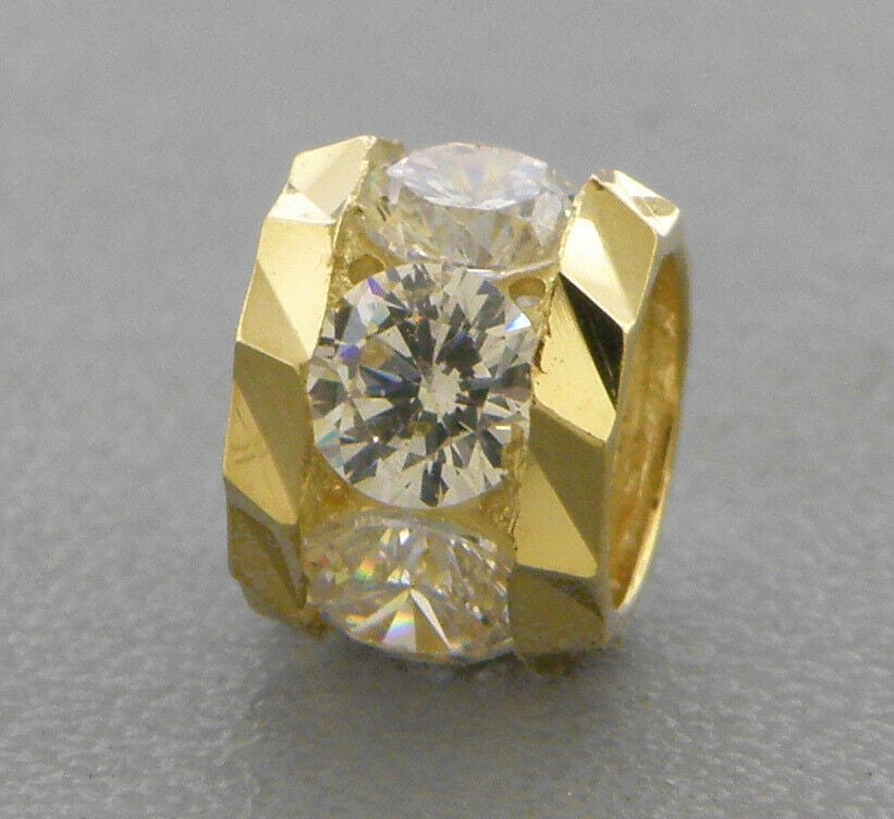 14K YELLOW GOLD CHARM PENDANT CZ CIRCLE SPACER BALL 7mm: NEW 14K YELLOW GOLD PENDANT New 14K Yellow Gold Pendant Measures: 5mm W x 7mm H - 0.6g Cubic Zirconia Pendant has a polished finish Stamp: 14k