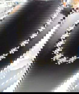 18KT GOLD FANCY GLITTERING 8.50CT FLOWER DIAMOND NECKLACE: Description LAST CALL, LAST CHANCE!!! LIQUIDATION SALE!!! The Following Item we are offering is a Rare 18KT White Gold Multi Flower Diamond Strand Necklace. Necklace is comprised of Finely Set Gorgeou