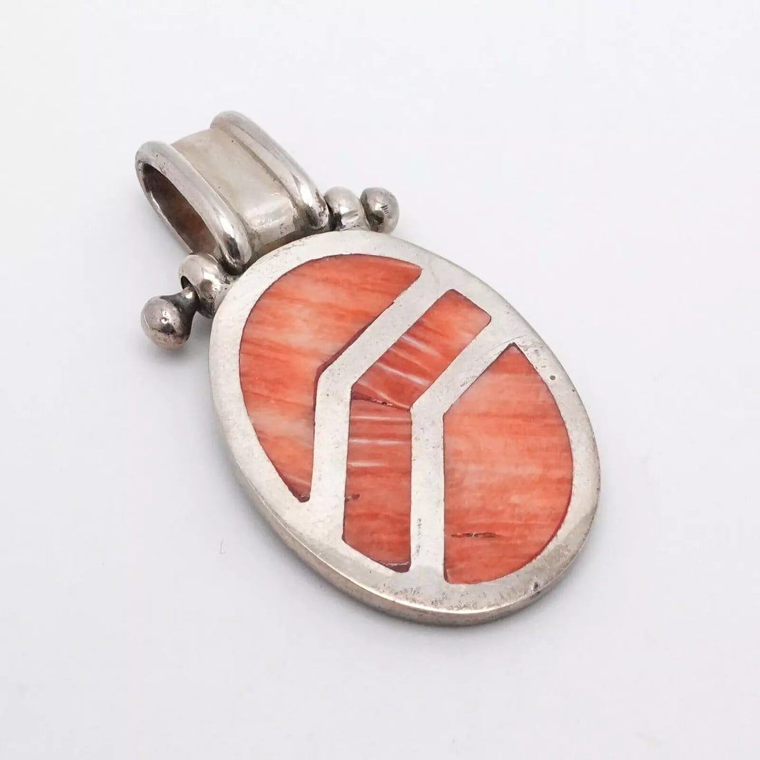 OP SILVER 950 ORANGE RED GEMSTONE INLAY OVAL PENDANT 2": OP SILVER 950 ORANGE RED GEMSTONE INLAY OVAL PENDANT 2" Silver 950 Orange Red Gemstone Inlay Oval Pendant Height - 2" Length - 1" Bail Height - 10mm Bail Width - 5mm Total Weight - 18.2 Grams