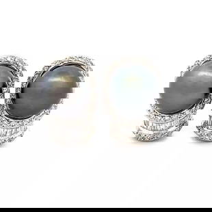 TAHITIAN PEARLS DIAMOND EARRINGS 18K WHITE GOLD POST BAGUETTE AND ROUND DIAMONDS: TAHITIAN PEARLS DIAMOND EARRINGS 18K WHITE GOLD POST BAGUETTE AND ROUND DIAMONDS This lovely pair of earrings are crafted from 18k white gold featuring a 11mm dark Black grayTanitian pearl in the top