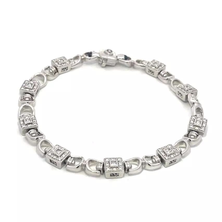 CHARRIOL DIAMOND BRACELET 18K WHITE GOLD SQUARE LINK DESIGN: CHARRIOL DIAMOND BRACELET 18K WHITE GOLD SQUARE LINK DESIGN This elegant authentic bracelet is by Charriol, it is crafted from 18k white gold featuring connecting U shape links which alternates with a