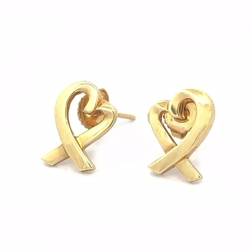 TIFFANY & CO. PICASSO STUD EARRINGS LOVING HEARTS IN 18K YELLOW GOLD: TIFFANY & CO. PICASSO STUD EARRINGS LOVING HEARTS IN 18K YELLOW GOLD This pair of authentic earrings are from Tiffany & Co. by designer Paloma Picasso from her Loving Hearts Collection. They are craft