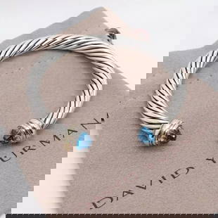 DAVID YURMAN STERLING SILVER 14K GOLD BLUE TOPAZ 7MM CABLE CUFF MEDIUM BRACELET: DAVID YURMAN STERLING SILVER 14K GOLD BLUE TOPAZ 7MM CLASSIC CABLE BRACELET David Yurman Sterling Silver & 14K Yellow Gold Blue Topaz Classic Cable Medium Ladies' Cuff Bracelet Fits up to 6 - 6.5" Wri