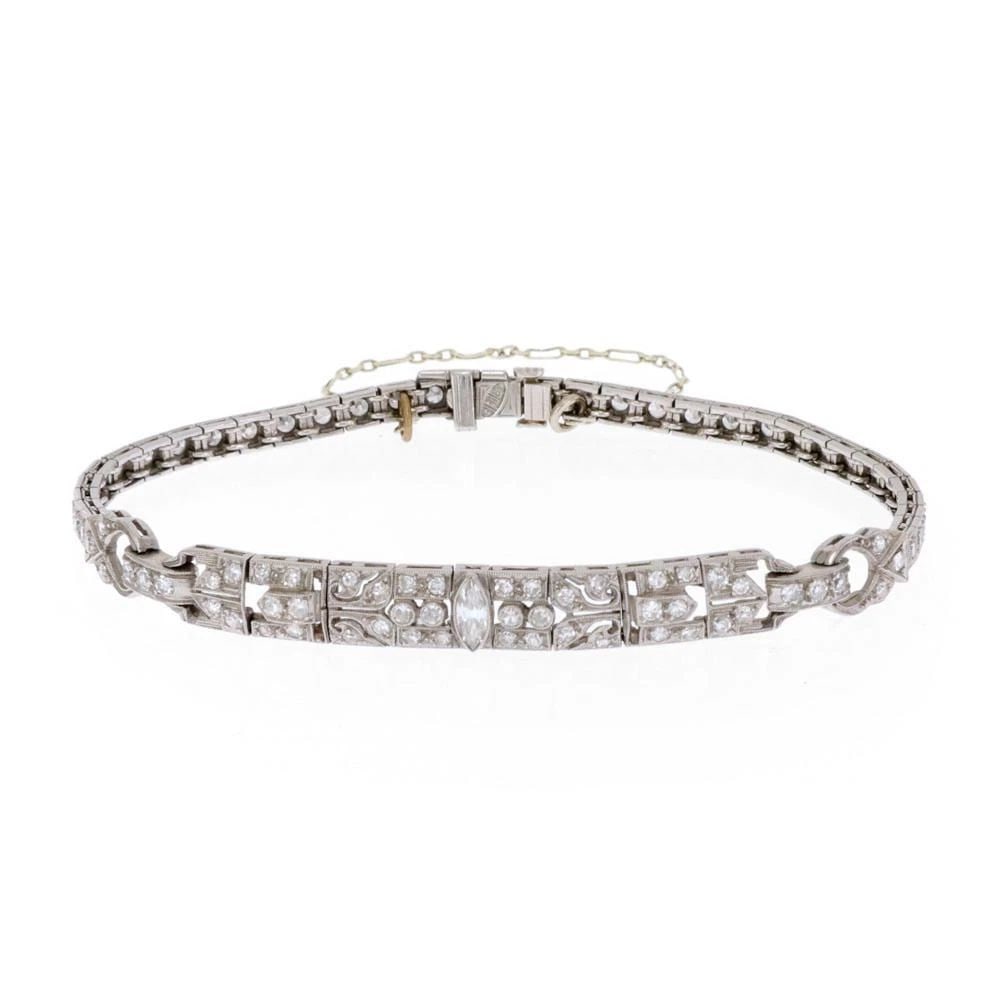 ART DECO BRACELET DIAMOND PLATINUM FLORAL MILGRAIN LINK DESIGN: ART DECO BRACELET DIAMOND PLATINUM FLORAL MILGRAIN LINK DESIGN Art Deco Diamond Platinum Floral Milgrain Link Bracelet Description This beautiful Art Deco bracelet is crafted from platinum. The 2.5 in
