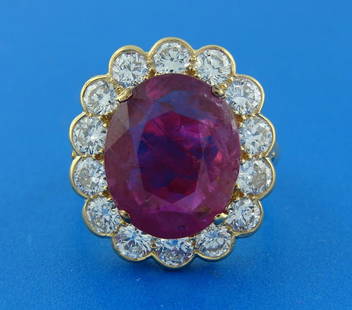 ELEGANT 6.32-CT RUBY 2.10 CTS DIAMOND 18K YELLOW GOLD RING COCKTAIL ENGAGEMENT: ELEGANT 6.32-CT RUBY 2.10 CTS DIAMOND 18K YELLOW GOLD RING COCKTAIL ENGAGEMENT 6.32-ct Ruby, Diamond & Yellow Gold Ring Elegant and classy ring. Features an oval over 6 carat ruby framed with fourteen