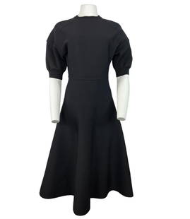 CHRISTIAN DIOR BLACK WOOL MIDI DRESS, SIZE 6: CHRISTIAN DIOR BLACK WOOL MIDI DRESS, SIZE 6 CHRISTIAN DIOR BLACK WOOL MIDI DRESS, SIZE 6 The dress features crew neck line, short balloon sleeves, midi length flare skirt, rear zip closure and knit f