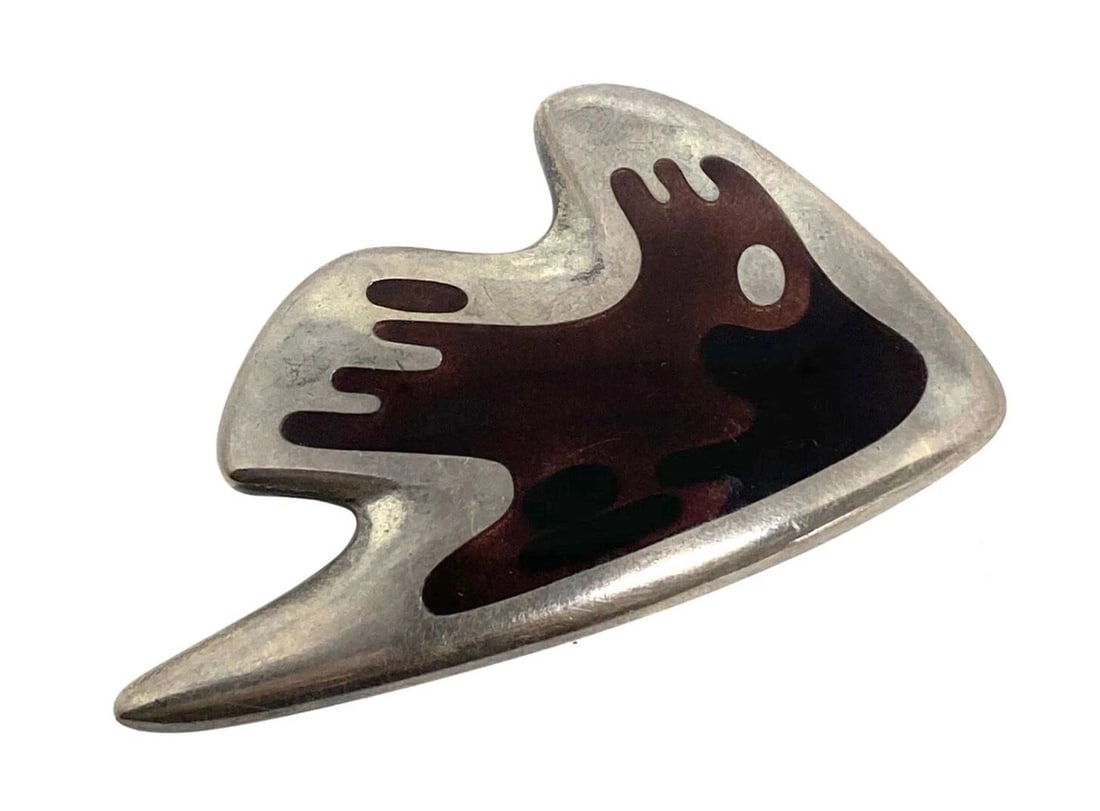 MID- CENTURY MODERN GEORG JENSEN STERLING SILVER & ENAMEL ABSTRACT BROOCH #307: MID- CENTURY MODERN GEORG JENSEN STERLING SILVER & ENAMEL ABSTRACT BROOCH #307 Circa 1947 Sterling silver and two- tone enamel detailed design Designed by Henning Koppel Inspired by the sea Signed Geo
