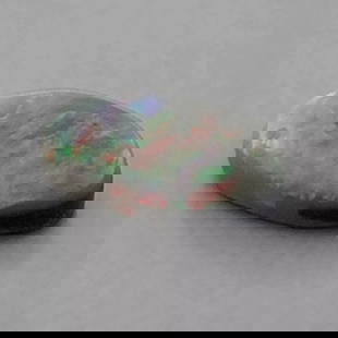 1.08ct LOOSE OVAL CABOCHON NATURAL BLACK OPAL AUSTRALIA: 1.08ct NATURAL BLACK OPAL Natural Untreated black opal Australian opal 1.08ct Measures 9.24mm x 5.32 x 2.93mm Black opal with red, green, purple and blue flashing colors