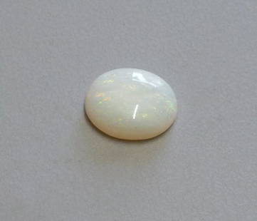 3.74ct LOOSE OVAL CABOCHON NATURAL WHITE OPAL 13x11mm: 3.74ct NATURAL WHITE OPAL Natural Untreated white opal 3.74ct Measures 14mm x 11mm x 4.2mm Nice colors, doesn't show well in pictures