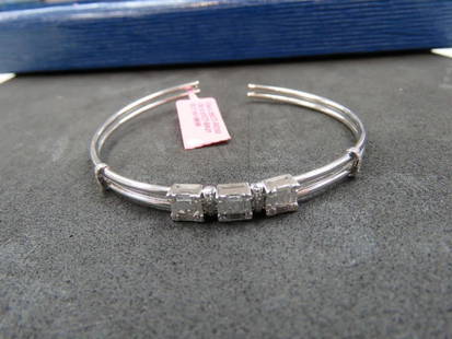 18KT GOLD FANCY BAGUETTE DIAMOND BANGLE BRACELET: 18KT GOLD FANCY BAGUETTE DIAMOND BANGLE BRACELET The Following Item we are offering is a Rare Magnificent Radiant 18KT Gold Large Rare Gorgeous Fancy Flower Diamond Bangle Bracelet. Bangle is