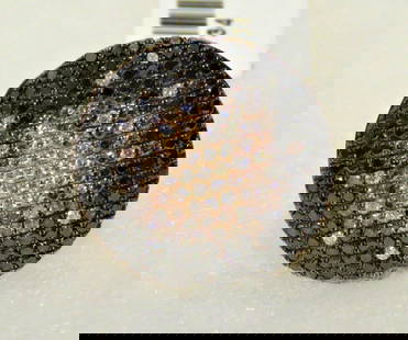 18KT BLACK DIAMOND CHAMPAGNE WHITE DIAMOND RING: 18KT BLACK DIAMOND CHAMPAGNE WHITE DIAMOND RING 18KT BLACK DIAMOND CHAMPAGNE WHITE DIAMOND RING The Following Items we are offering is a Rare Important 18KT Rose White Gold Black Diamond, White